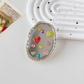 Dettaglio del supporto per telefono con cuori colorati, paillettes e bordo argento vintage - Supporto Trasparente-Ovale Glitter-Cuore di Diamante Colorato