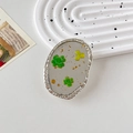 Dettaglio del supporto per telefono ovale con bordo argentato, trifoglio verde e oro - Supporto Trasparente-Ovale Foglia d'Oro-Trifoglio