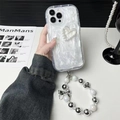 Dettaglio custodia iPhone con cuore di perle strass e cinturino da polso con perline - Custodia Bianco Crema - Cuore Di Perla Cavo - Catena Di Perle Sfumate - Glitter Bianco / iPhone 7/8/SE 2020