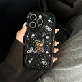 Glittery black wavy iPhone case with rhinestones, golden bear, and bowknots held by hand - iPhone 7/8/SE 2020 / Black