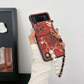 Detail of red glitter phone case with pearl chain strap and rhinestone bow for Z Flip 5 - Red / Samsung ZFlip3
