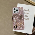 Close-up of luxury iPhone case with pink rhinestones, pearls, and bow detailing - iPhone 7/8/SE 2020 / Pink