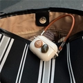 Elegant silicone AirPods Pro case with decorative gemstones and leather hand strap - Generation 1 2