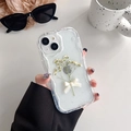 Detail of iPhone case featuring wavy edges with white dry flowers and a 3D ribbon bow - Cream Glitter Dried Flowers - White / iPhone 7/8/SE 2020