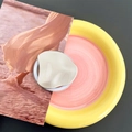 Detail of silver metallic irregular lava drop phone socket on a colorful plate - Transparent Magnetic Abstract Fluid Silver
