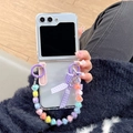Detailed view of clear Galaxy Z Flip case with colorful heart beads and plaid bow handle - Samsung ZFlip3 / Purple Bowknot Colorful Heart Chain (Hard Shell)