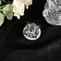 Detail of luxury MagSafe phone grip featuring grey crystals and diamonds on black velvet - Gemstone Flower Black Style 44