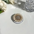 Close-up of Magsafe phone grip with sunflower rhinestone design and pearl accents - Gemstone Style 7 Full Rhinestone Pearl