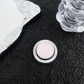 Detail of pink magnetic phone socket with Gift For You print on dark textured backdrop - Light Pink