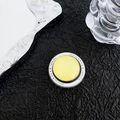 Close-up of yellow glass magnetic phone socket with Gift For You text on black texture - Light Yellow
