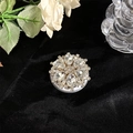 Detail view of Magsafe phone socket featuring luxury rhinestone flower and silver base - Large Full Rhinestone White Style 32
