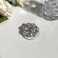 Detail of crystal floral MagSafe phone grip with purple rhinestones and acrylic base - Gemstone Style 10 - Purple