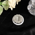 Macro view of luxury MagSafe phone grip with radiant rhinestones and round mirror - Silver Base White Gemstone Style 20