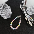 Close-up of macaron color beads with transparent rings and silver lobster clasp - Colorful Beaded Chain