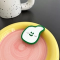 Close-up of a green-bordered mirror phone socket with a smiling face on a ceramic plate - Dark Green