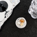 Detailed view of a circular phone socket featuring pearls and amber-colored gemstones - Apricot Amber Pearl Smudge Style