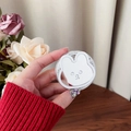 Detail of white rabbit phone socket holder with Gift For You card in a hand - Magnetic Rabbit Holder - White