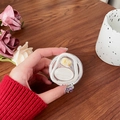 Close-up of magnetic phone socket with Gift For You engraving and amber gemstone inlay - Irregular Ring Gradient Apricot