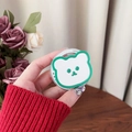 Detail of cute bear MagSafe phone grip being held, featuring green outline and Gift design - Dark Green Bear Mirror