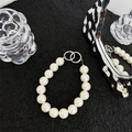 Detailed shot of large round pearls on a stylish mobile wrist strap with silver metal rings - Double Ring 15 Beads 18mm Pearl Chain