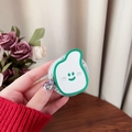 Close-up of cute pear-shaped acrylic phone grip with a smile design on wooden background - Dark Green
