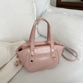 Minimalist lotus pink PU leather bucket bag with brass rivets and adjustable strap - Pink