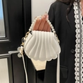 Elegant white shell-shaped handbag with pearl handle and crossbody strap for women - White