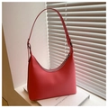 Detail view of pink hobo bag with silver metal rings and smooth matte leather texture - Pink