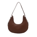 Brown half-moon hobo bag with woven leather texture and minimalist shoulder strap - Tan