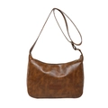 Vintage brown leather crescent shoulder bag with adjustable strap on white background - Brown