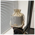 Detail of silver snake skin bucket bag with pearl handle and metal chain strap - Silver