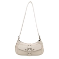 Chic off-white underarm bag with vintage buckle and silver metal eyelets on white background - White