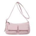 Pink candy-colored crossbody shoulder bag with dual front pockets and adjustable strap - Pink