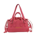 Fashionable pink drawstring handbag with litchi grain leather and golden lettering - Pink