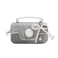 Gray denim crossbody bag with white handle and pearl bow pendant in a frontal studio view - White with Pendant