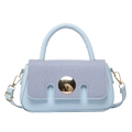 Light blue crossbody handbag with gold buckle and top handle on a clean white background - Blue