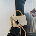 Champagne gold glitter flap handbag with black geometric metal buckle and top handle strap - Gold