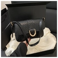 Detail of black woven texture faux leather handbag with elegant gold metal horseshoe buckle - Black
