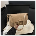 Close-up of khaki embossed leather shoulder bag in a premium black gift box set - Khaki
