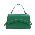 Green PU leather handbag with embossed wave texture and gold hardware on white background - Green