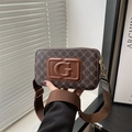 Retro brown monogram crossbody bag with wide strap and embossed G logo on front - Brown