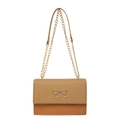 Brown patchwork crossbody bag with gold bow buckle and chain strap on white backdrop - Brown