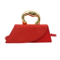 Red suede tote bag with artistic gold metal handle and slim shoulder strap on white backdrop - Red