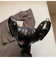 Close-up of black pleated faux leather crescent bag with silver hardware detail - Black