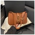 Detail of a brown hobo bag with gold buckle in premium gift box packaging - Dark Brown