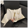 Detail of white leather hobo bag with gold metal clasp and adjustable strap in gift box - White