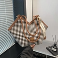 Houndstooth textured tote bag with brown faux leather handles and a bow ribbon detail - Brown