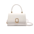 Minimalist white leather handbag with sleek round handle and gold oval buckle detail - White