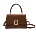 Minimalist brown crossbody bag with trapezoidal shape and gold oval buckle detail - Brown
