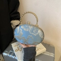Borsa da sera azzurra con ricami floreali dorati e manico metallico intrecciato - Blu